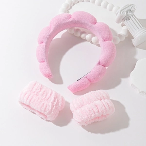 Pink sponge spa headband and wristband set for face washing and skincare routines