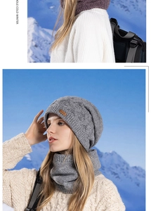 Close-up of gray cable-knit winter hat and neck warmer set against snow mountain backdrop