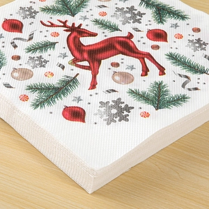 Christmas paper napkins with festive reindeer, pine branch and snowflake print