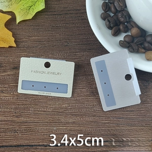 Detail view of 3.4x5cm jewelry display cards with Silver S925 text and leather-textured paper