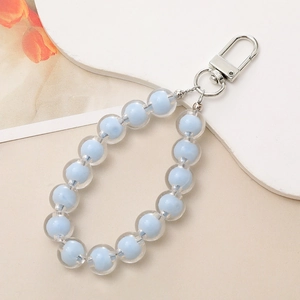 Detail of blue and clear beaded phone charm strap with silver metal clasp