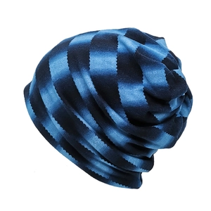 Blue striped slouchy beanie for women and men, featuring a classic knit texture