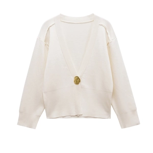 Cream V-neck loose knit cardigan featuring a single gold metal button closure