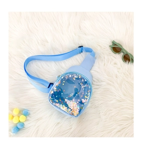 Detail of light blue kids chest bag with transparent window and colorful flowing sequins