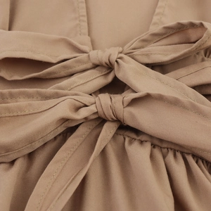 Elegant khaki puff sleeve maxi dress with V-neckline and decorative bow tie waist detail