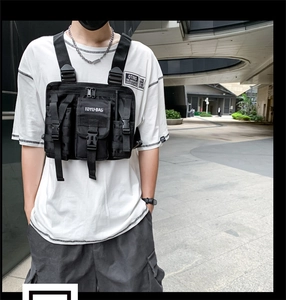 Tactical chest bag detail featuring multiple buckles and adjustable MOLLE system straps