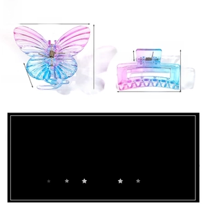 Detail view of butterfly and rectangular hair clips with blue to pink gradient texture