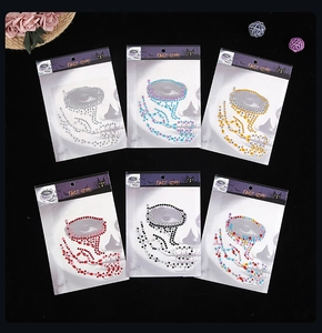 Macro view of assorted Halloween face gems in silver, blue, gold, red, and black styles