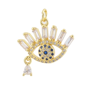 Macro detail of 18K gold plated evil eye charm with micro-pawned zircon stones