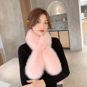 Pink faux fur cross scarf for women, thick plush winter neck warmer in modern setting