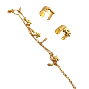 Golden stainless steel jewelry set featuring starfish and leaf charms on white background