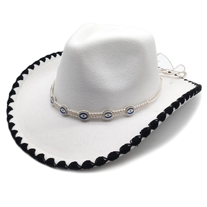 White Western cowboy hat with black whipstitched brim and Evil Eye beaded band