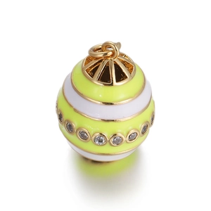 Macro detail of enamel evil eye pendant with yellow-green stripes and white zircon pavé