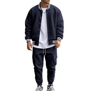 Detail of dark blue baseball jacket with striped rib-knit collar and matching cargo pants