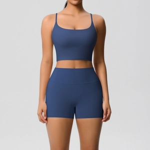 Detail of high-stretch dark blue yoga set with thin strap sports bra and high waist shorts