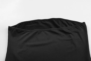 Close-up of fine stitching and mesh texture on black slim-fit bodycon dress