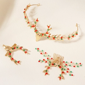 Detail of three-piece Christmas reindeer headbands and clips with red and green beads