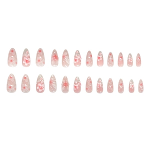 Almond shaped press-on nails featuring 3D floral designs with pearls and pink gradient
