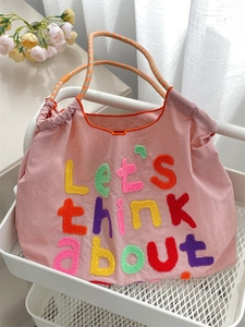 Pink large canvas tote bag with colorful towel embroidery and checkered woven handles