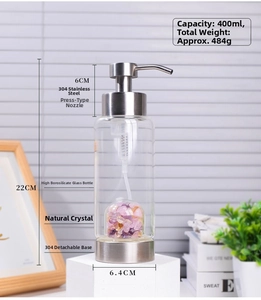 Detail of 400ml glass soap dispenser featuring pink natural crystal stones inside
