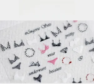 Macro shot of 5D thin transparent nail stickers featuring chic lingerie illustrations