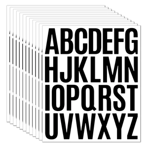 Close-up of waterproof alphabet stickers with black letters on white background for DIY