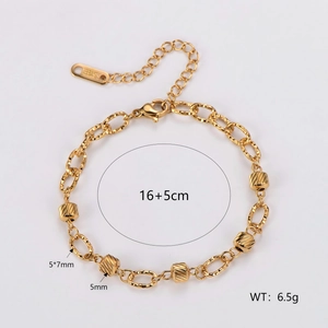 Gold plated stainless steel bracelet with faceted cylindrical beads and oval chain links