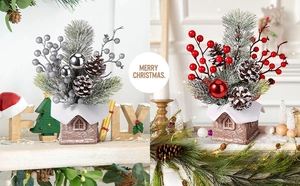 Detail view of mini tabletop Christmas trees with snowy house pots in red and silver