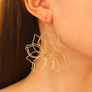 Fashion gold layered woven lotus flower statement earrings worn by a female model
