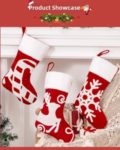 Detail of red Christmas stockings with white 3D embroidery and plush faux fur cuffs