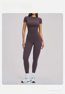 Detail of mauve high-elastic yoga set featuring slimming T-shirt and tight fitness leggings