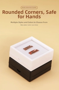 Detailed close-up of clear acrylic gemstone display boxes with soft inner foam padding