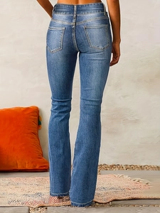 Rear view of vintage blue washed stretch flare jeans showing slim fit and pocket detail