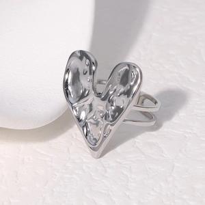 Minimalist silver heart-shaped open ring with unique textured finish and adjustable band