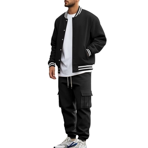 Detail of men's black varsity jacket and cargo pants with white striped ribbed collar