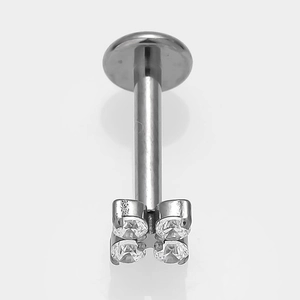 Macro detail of G23 titanium labret stud with four square cubic zirconia stones