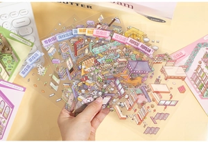 Detailed PET stickers showing miniature store scenes like flower shops for journaling