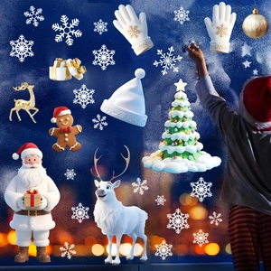 A child decorates window glass with colorful Santa, elk, and snowflake Christmas stickers
