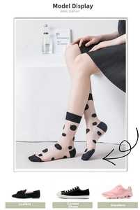 Close-up of sheer mesh socks with black polka dots and reinforced heel detail