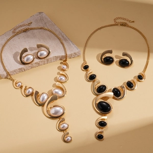 Gold-tone acrylic oval geometric necklace and stud earrings set with pearl accents