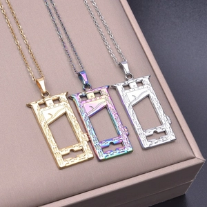 Detailed view of guillotine pendant necklaces in gold, silver, and rainbow steel