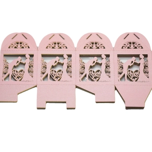Pink laser-cut wedding favor box with heart silhouette and thank you engraving