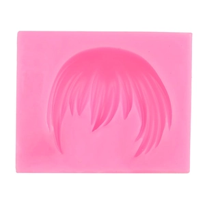 Stampo in silicone rosa per texture capelli in argilla o fondente su sfondo bianco