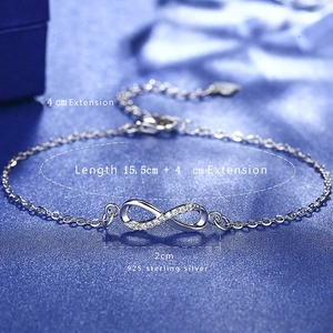 925 sterling silver infinity bracelet with pavé diamonds on blue velvet background