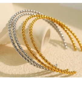 Detailed macro view of the twisted metal texture on these stylish gold and silver headbands