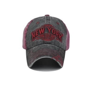 Macro shot of 3D New York embroidery and distressed washed cotton texture on baseball cap