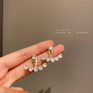 Sparkling gold heart zirconia earrings with curved crystal design for a stylish look