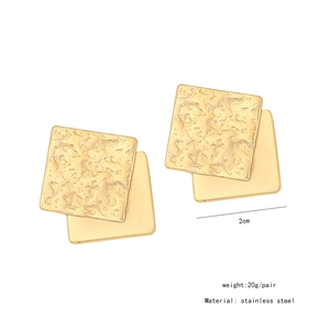 Macro shot of 2cm irregular square gold stainless steel earrings weighing 20g per pair
