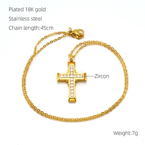 Detailed view of 18K gold plated stainless steel cross necklace with zircon stones