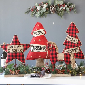 Plaid fabric Christmas tree and star tabletop ornaments on a festive wooden base